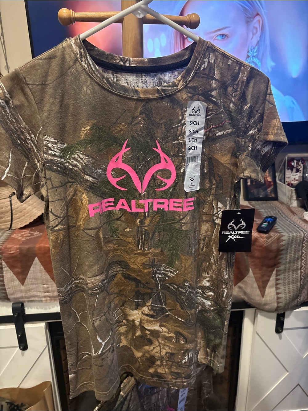 Realtree women’s size small Camo Tee with Pink Logo